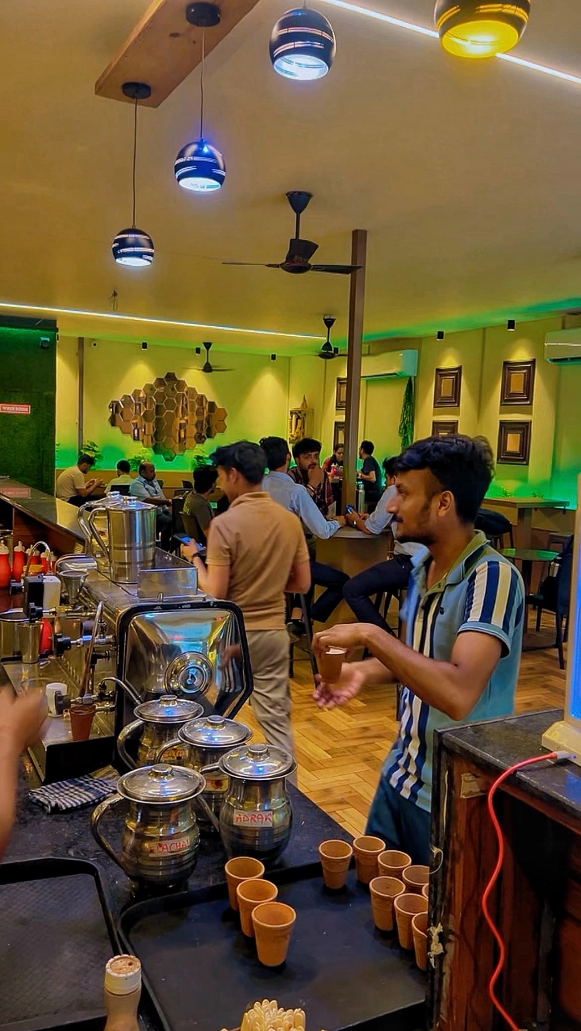 Busy service counter and cafe interior at Chai Sutta Bar Bharuch
