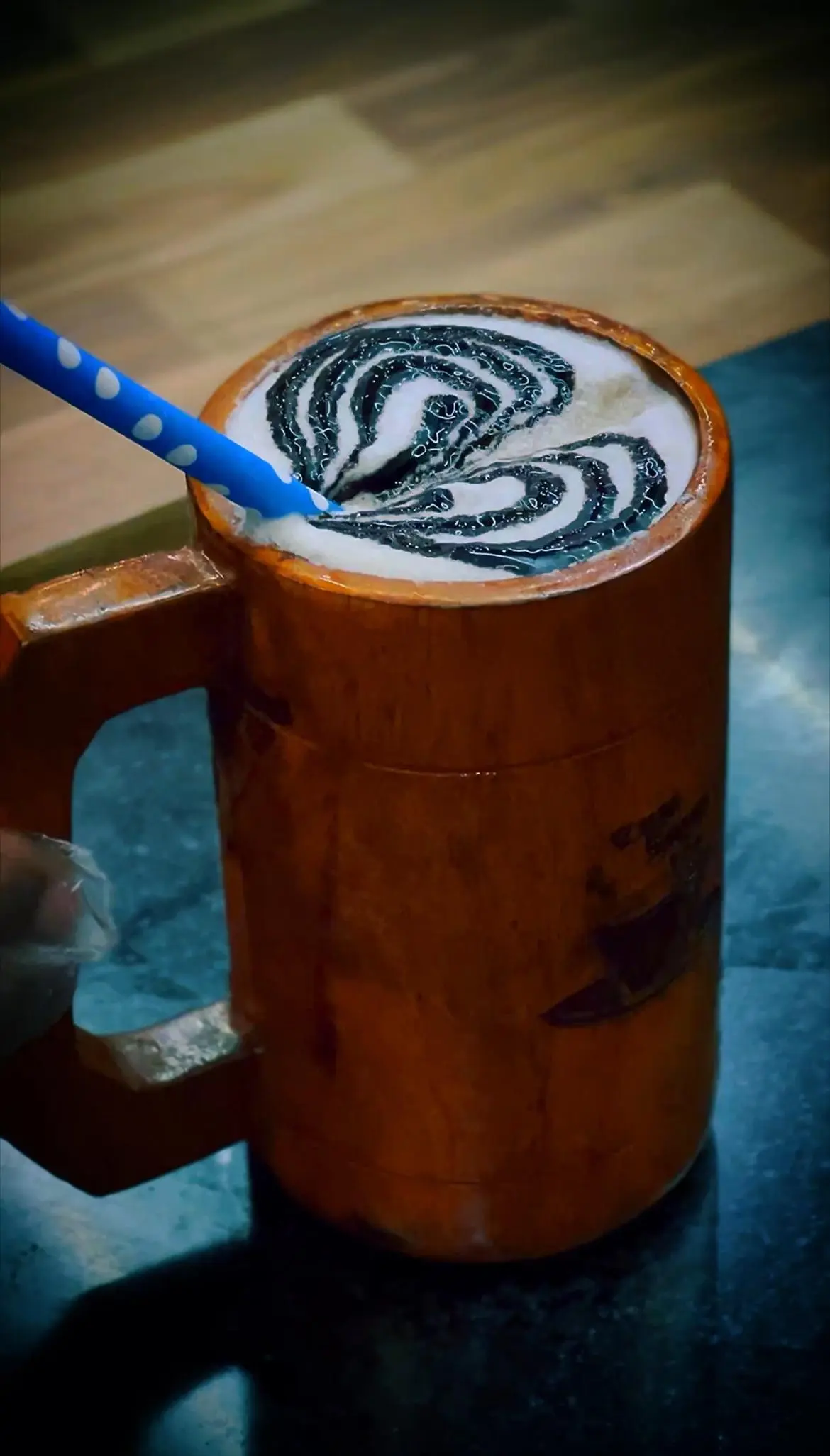 Creamy drink with pistachio topping served in a kulhad