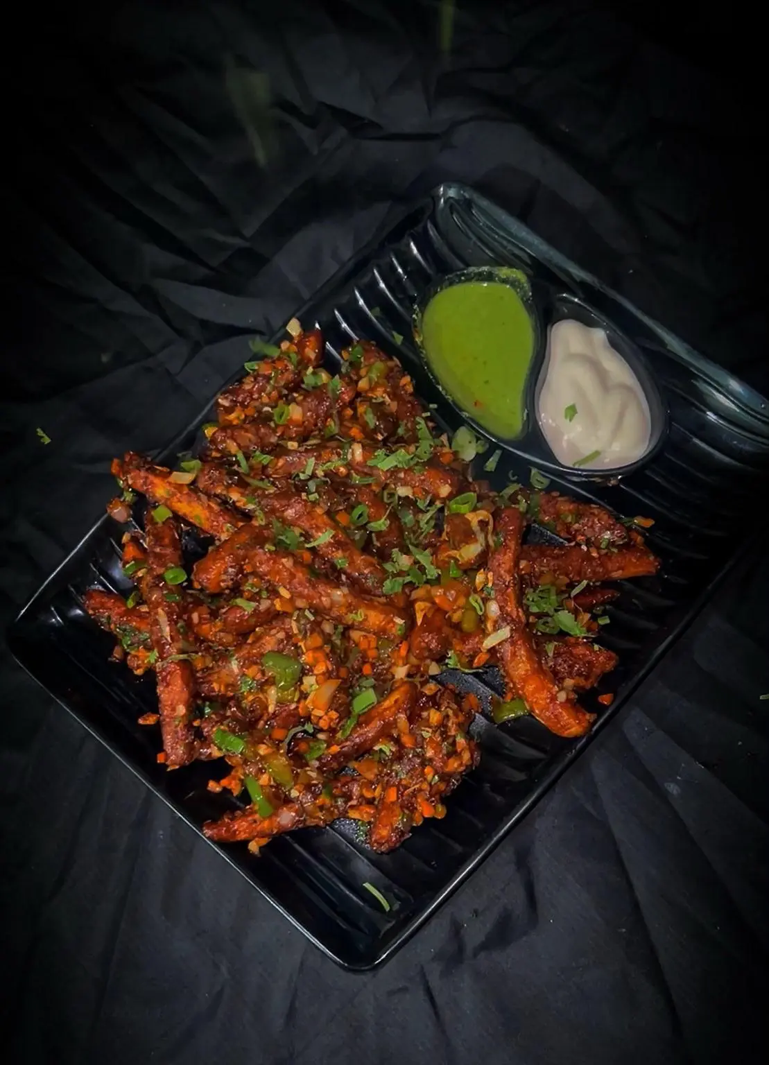 Loaded seasoned fries with dips at Chai Sutta Bar Bharuch